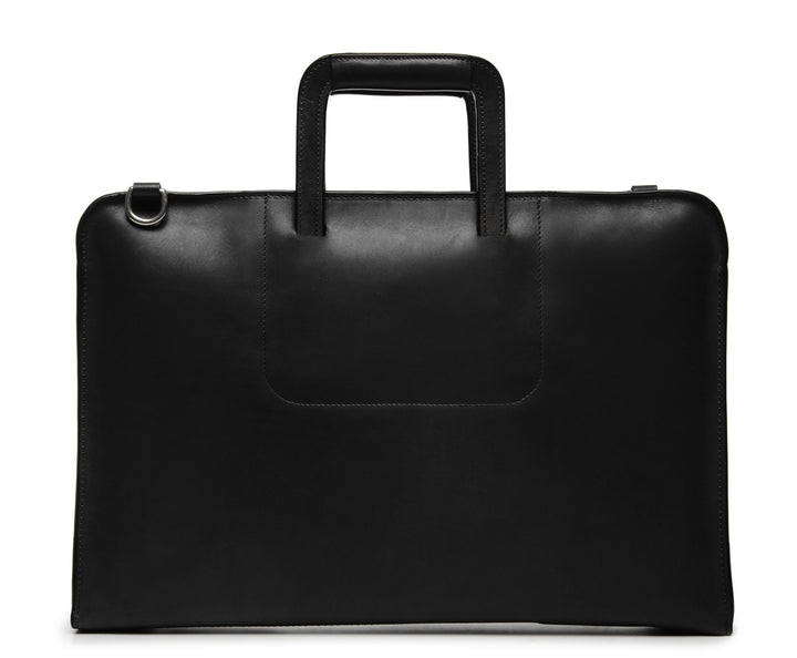 Black Leather Zippered Briefcase The Jackson is handcrafted with a beautiful full grain mill dyed American leather in a timeless Korchmar design. It includes a removable padded laptop sleeve. Historically not an item designed for shoulder carry, the new, improved design includes a full length adjustable shoulder strap. #color_black