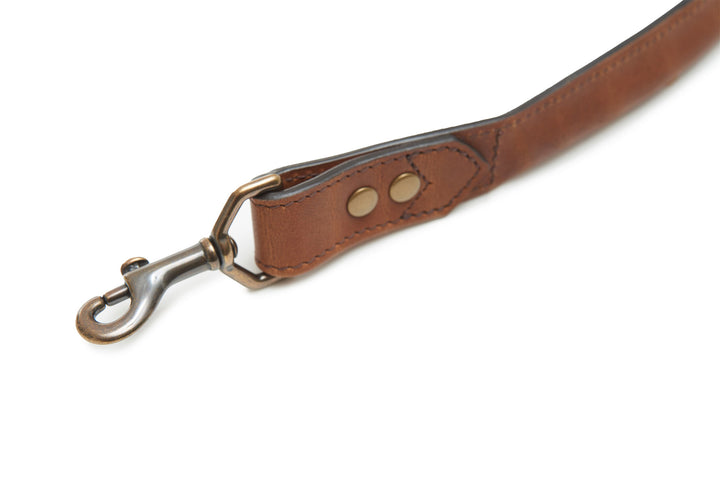 Espresso Full-grain American leather Solid brass swivel snap Handcrafted with care in our own factory Dimensions: 5' L x 1" W #color_espresso
