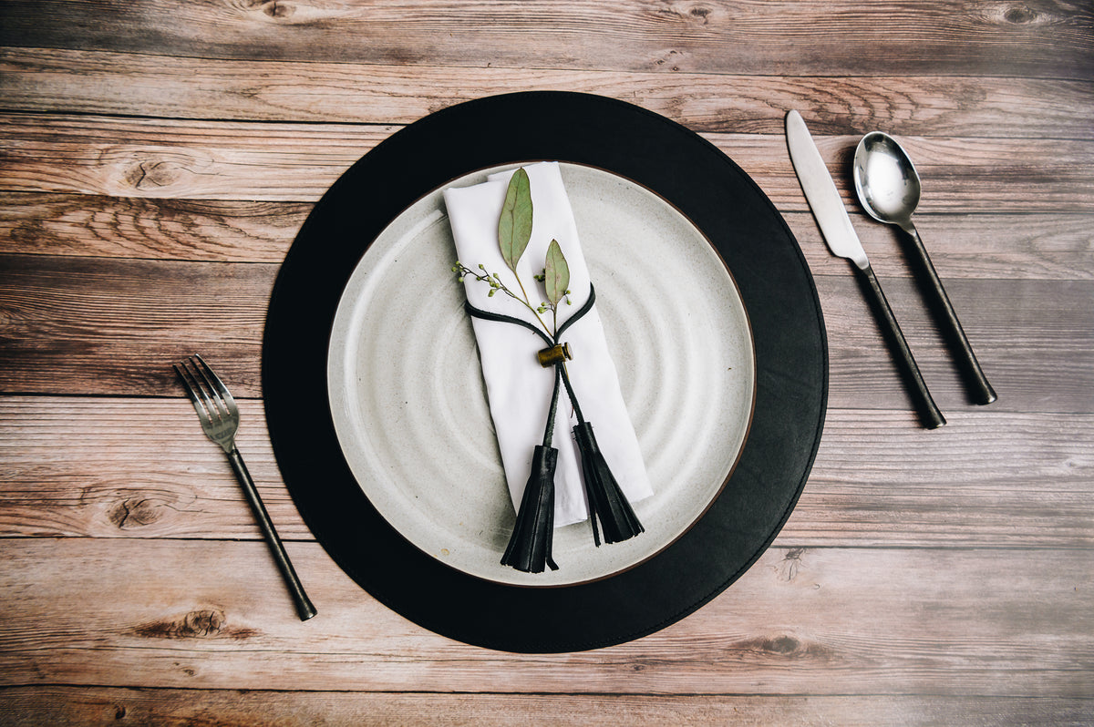 Add richness and depth to your dining table with the Nelson leather placemat. The Nelson is handcrafted with American full-grain leather and is backed with a non-skid durable rubber mat. #color_black