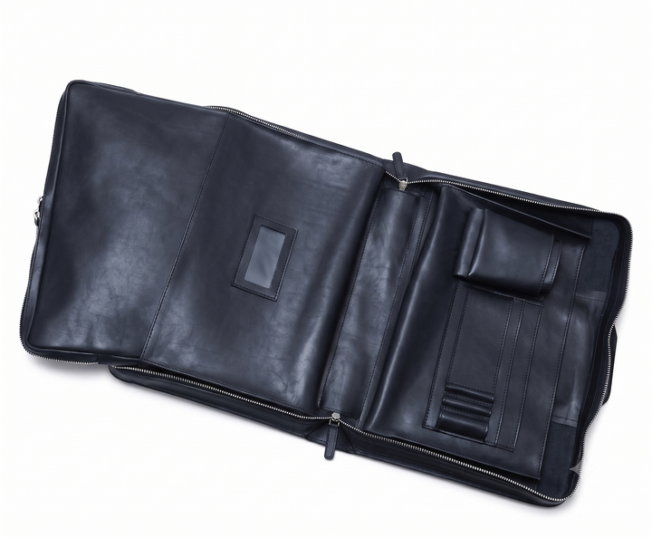 Ocean Blue Leather Zippered Briefcase The Jackson is handcrafted with a beautiful full grain mill dyed American leather in a timeless Korchmar design. It includes a removable padded laptop sleeve. Historically not an item designed for shoulder carry, the new, improved design includes a full length adjustable shoulder strap. #color_ocean-blue