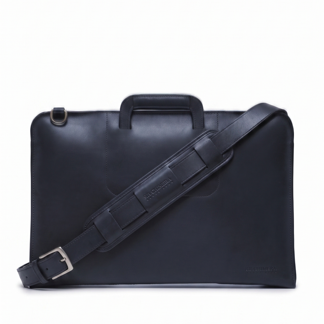 Ocean Blue Leather Zippered Briefcase The Jackson is handcrafted with a beautiful full grain mill dyed American leather in a timeless Korchmar design. It includes a removable padded laptop sleeve. Historically not an item designed for shoulder carry, the new, improved design includes a full length adjustable shoulder strap. #color_ocean-blue