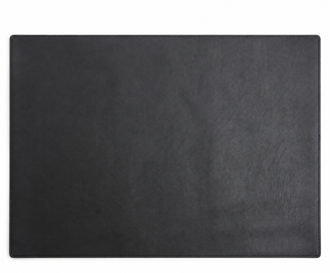 Black Leather desk pad Handcrafted with American full-grain leather, the Carter leather desk pad adds a sophisticated touch to your work-from-home setup while protecting your desk's surface from scratches. #color_black