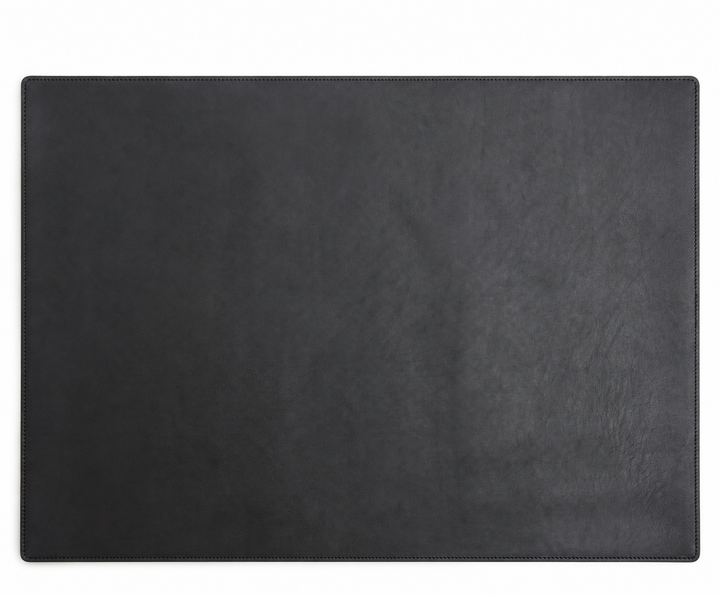 Black Leather desk pad Handcrafted with American full-grain leather, the Carter leather desk pad adds a sophisticated touch to your work-from-home setup while protecting your desk's surface from scratches. #color_black