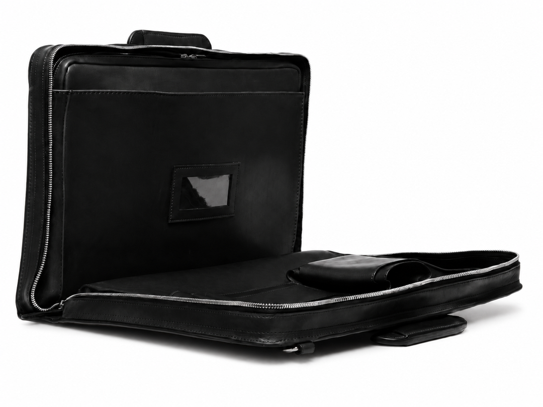Black Leather Zippered Briefcase The Jackson is handcrafted with a beautiful full grain mill dyed American leather in a timeless Korchmar design. It includes a removable padded laptop sleeve. Historically not an item designed for shoulder carry, the new, improved design includes a full length adjustable shoulder strap. #color_black