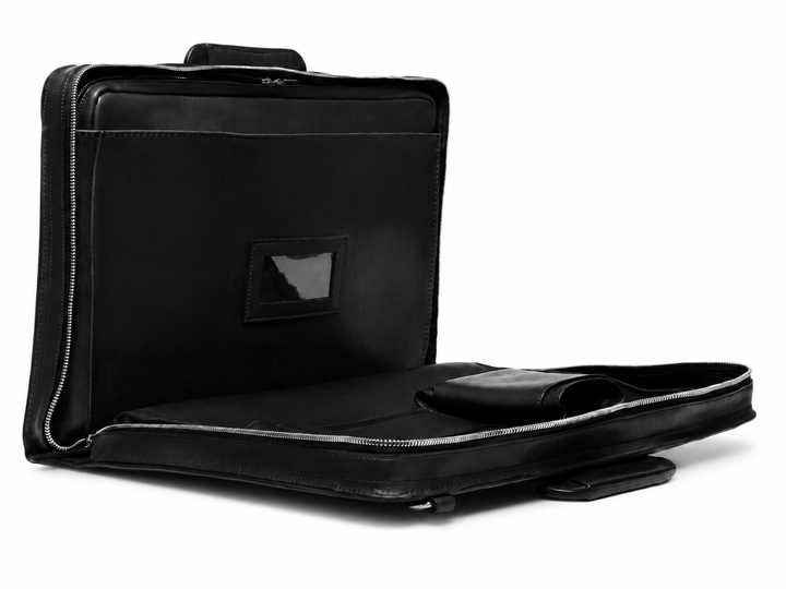 Black Leather Zippered Briefcase The Jackson is handcrafted with a beautiful full grain mill dyed American leather in a timeless Korchmar design. It includes a removable padded laptop sleeve. Historically not an item designed for shoulder carry, the new, improved design includes a full length adjustable shoulder strap. #color_black