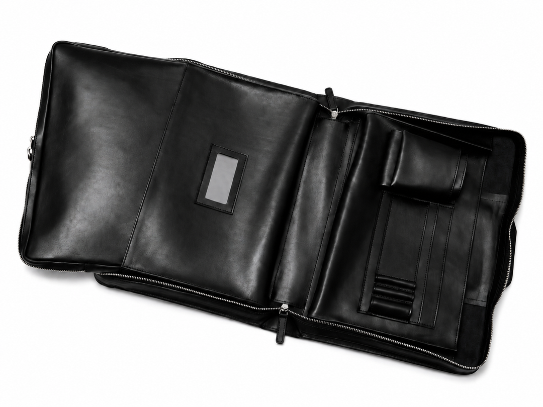 Black Leather Zippered Briefcase The Jackson is handcrafted with a beautiful full grain mill dyed American leather in a timeless Korchmar design. It includes a removable padded laptop sleeve. Historically not an item designed for shoulder carry, the new, improved design includes a full length adjustable shoulder strap. #color_black