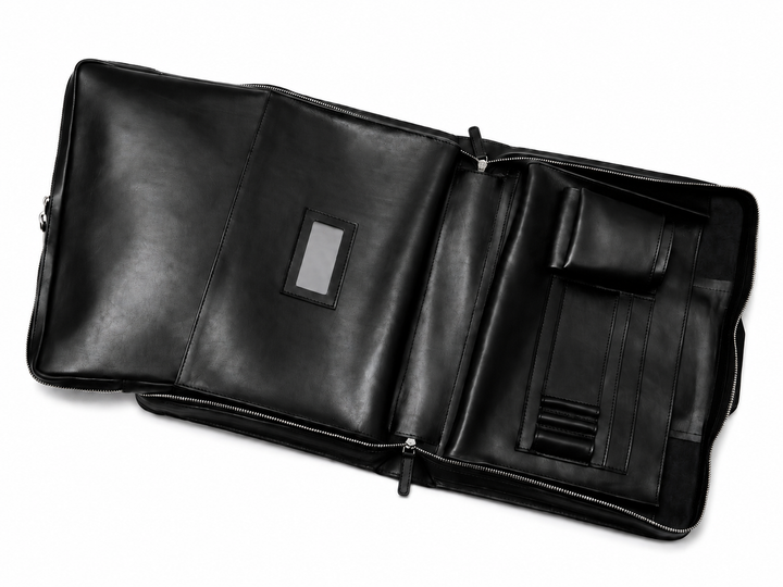 Black Leather Zippered Briefcase The Jackson is handcrafted with a beautiful full grain mill dyed American leather in a timeless Korchmar design. It includes a removable padded laptop sleeve. Historically not an item designed for shoulder carry, the new, improved design includes a full length adjustable shoulder strap. #color_black