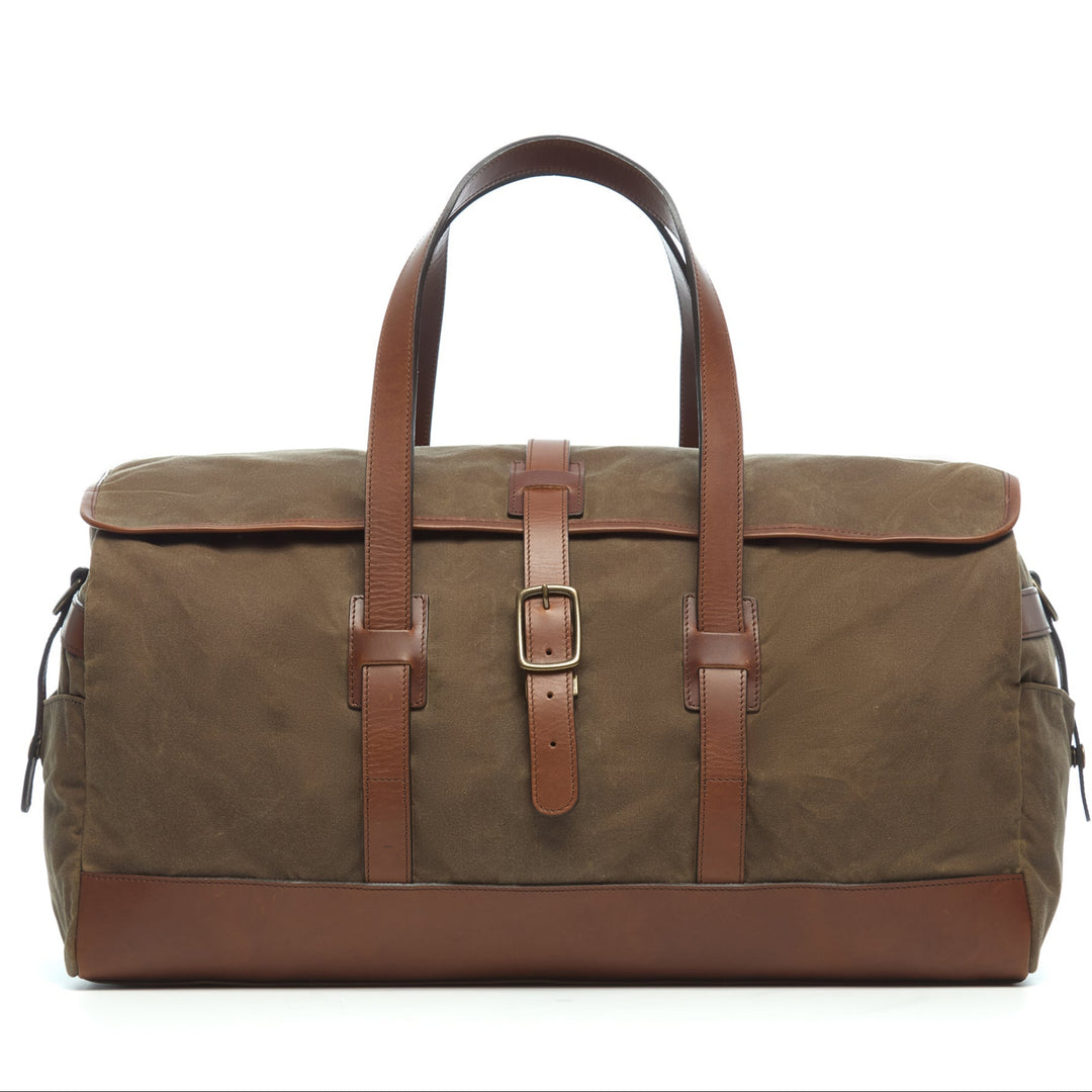 Olive 22" Waxed Canvas Weekender One of our best-selling weekender styles, the waxed canvas Twain is ideal for leisure or business travel. At 22", it is designed to fit comfortably in most airline overhead compartments. The Twain waxed canvas duffel bag is handcrafted with water-resistant waxed canvas and includes a removable, adjustable leather shoulder strap.