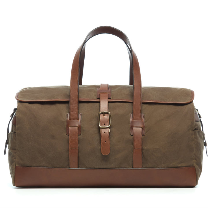 Olive 22" Waxed Canvas Weekender One of our best-selling weekender styles, the waxed canvas Twain is ideal for leisure or business travel. At 22", it is designed to fit comfortably in most airline overhead compartments. The Twain waxed canvas duffel bag is handcrafted with water-resistant waxed canvas and includes a removable, adjustable leather shoulder strap.