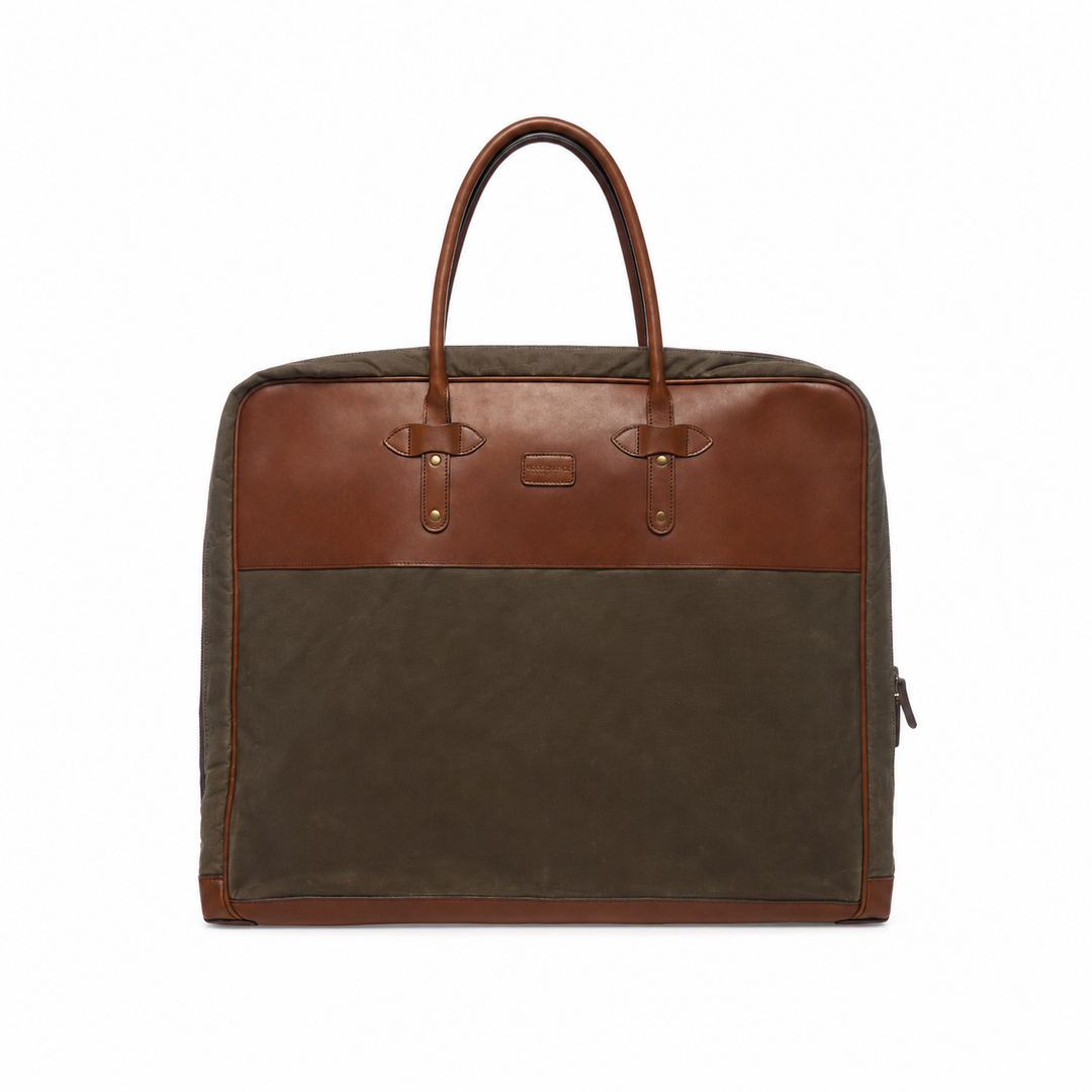 Olive Back view of the Prescott olive waxed canvas garment bag with brown leather panel and carrying handles