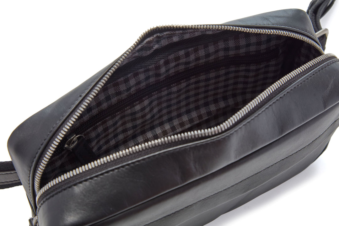 Mercer Leather Sling in Black interior with plaid lining and zippered pocket