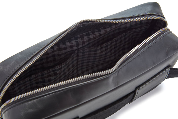 Mercer Leather Sling in Black interior with plaid lining and slip pocket