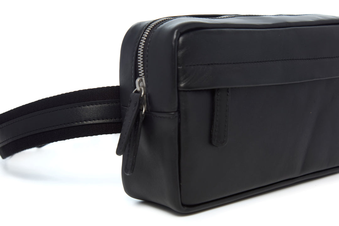 Mercer Leather Sling in Black concealed front zipper and leather pull detail