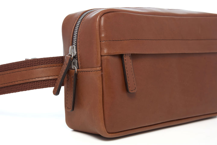 Mercer Leather Sling in Brown concealed front zipper and leather pull detail