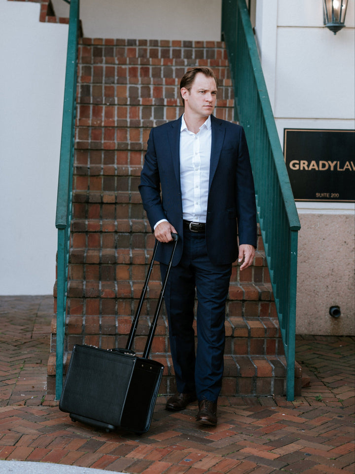 Black Vinyl Wheeled Catalog Case A top selling professional catalog case, the Defender is a durable and sleek solution for transporting a large volume of files. The Defender features a secure combination locking system, and is handcrafted using Marvelon vinyl.