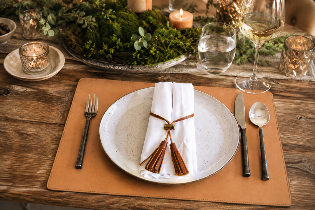 Tan Leather rectangular placemat Add elegance to your dining table with the Nash leather placemat. Available in three classic, neutral colors, the Nash leather placemat is backed with a non-skid durable rubber mat. #color_tan