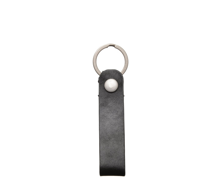 Korchmar Black leather keychain Full grain mill dyed American leather Steel key rings Handcrafted with care in our own factory Dimensions: 5" x 1.25"  FREE Monogramming up to 3 letters.