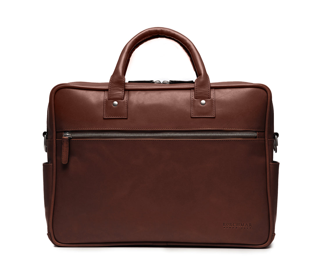 Brown 15" Leather Laptop Briefcase Meticulously designed with full-grain leather, the Redford leather briefcase is a seamless blend of modern functionality and classic style. With two zippered compartments, multiple organizational pockets and a dedicated laptop compartment, the Redford is designed to protect your everyday essentials. #color_brown