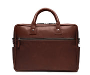 Brown 15" Leather Laptop Briefcase Meticulously designed with full-grain leather, the Redford leather briefcase is a seamless blend of modern functionality and classic style. With two zippered compartments, multiple organizational pockets and a dedicated laptop compartment, the Redford is designed to protect your everyday essentials.