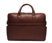 Brown Lightweight construction, handcrafted with American full-grain leather 2 main compartments Multiple organizational pockets, including a cell phone pocket, two additional exterior pockets, and an interior zippered pocket Reinforced roller bag attachment strap that lays flat when not in use Solid brass zipper and hardware with a nickel finish Dimensions: 16" x 4.75" x 12"