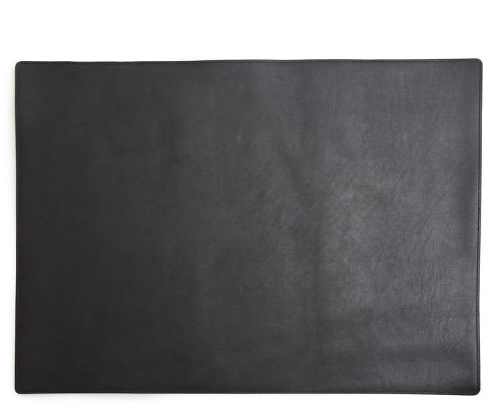 Black Leather desk pad Handcrafted with American full-grain leather, the Carter leather desk pad adds a sophisticated touch to your work-from-home setup while protecting your desk's surface from scratches. #color_black