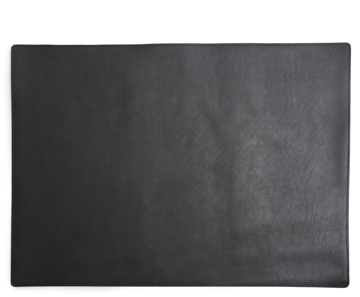 Black Leather desk pad Handcrafted with American full-grain leather, the Carter leather desk pad adds a sophisticated touch to your work-from-home setup while protecting your desk's surface from scratches.