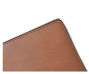 Espresso Full-grain American leather Backed with non-skid durable rubber mat Each desk pad's selection is one-of-a-kind and slightly unique given the natural characteristics of the leather Handcrafted with care in our own factory Dimensions: 24" W x 17.5" H