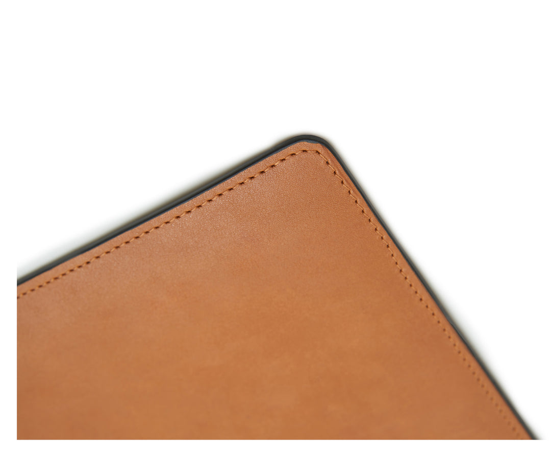 Tan Full-grain American leather Backed with non-skid durable rubber mat Each desk pad's selection is one-of-a-kind and slightly unique given the natural characteristics of the leather Handcrafted with care in our own factory Dimensions: 24" W x 17.5" H #color_tan
