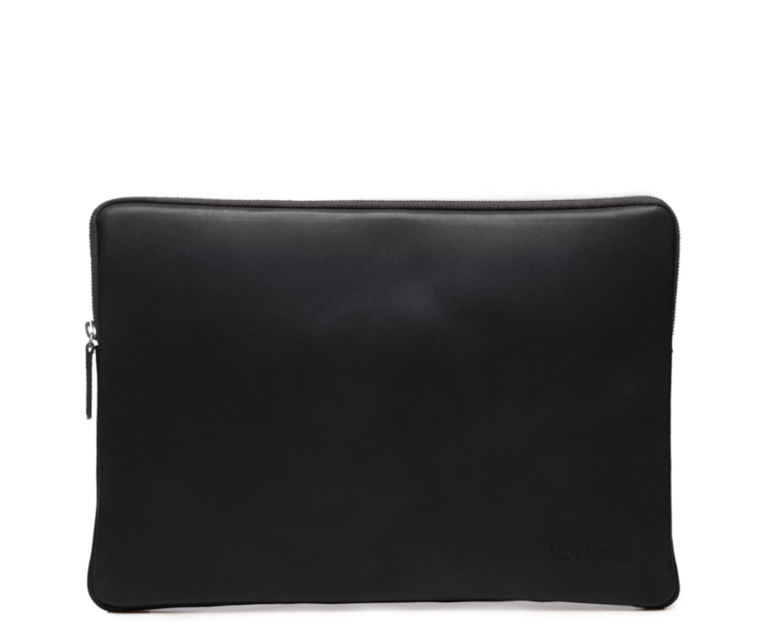 Black Laptop Sleeve The Clifford laptop sleeve in Korchmar's Classic Leather is made of American cowhide leather that is selected from the top 5% of available hides. Colored only with aniline dyes, this leather retains its natural beauty over time and features visible markings that are characteristic of only the finest leather. #color_black