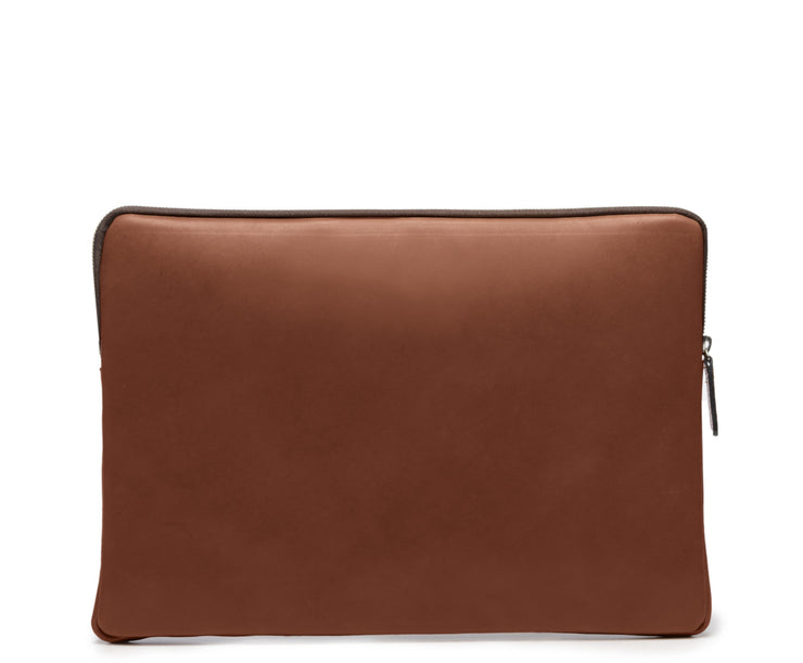 Brown Full grain American leather Padded construction designed to protect most 14" laptops and some 15" Lined interior 15" Leather Laptop Sleeve Dimensions: 13.5" x 2" x 10"