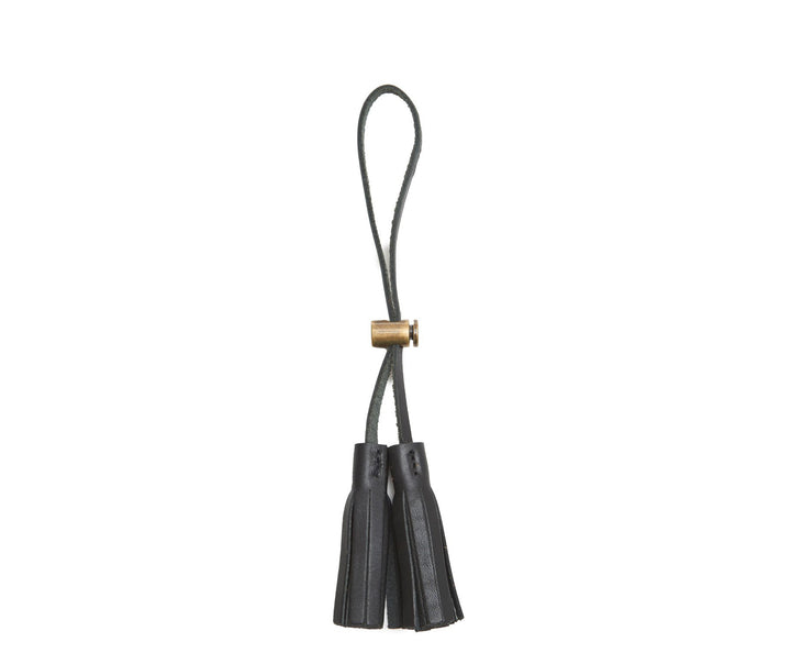 Black Leather tassel keeper Add texture to your décor and get creative with the Cooper leather tassel keepers. Perfect for use as napkin holders, on curtains or doorknobs, as carry-on bag identifiers, and so much more. The Cooper leather tassel keepers are handcrafted with full-grain American leather. #color_black