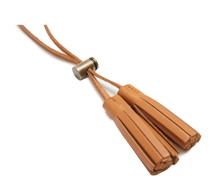 Tan Full-grain American leather Includes removable slider lock hardware, which allows the loops to be tightened Usable in various applications 18" L Handcrafted with care in our own factory Dimensions: 18" L #color_tan