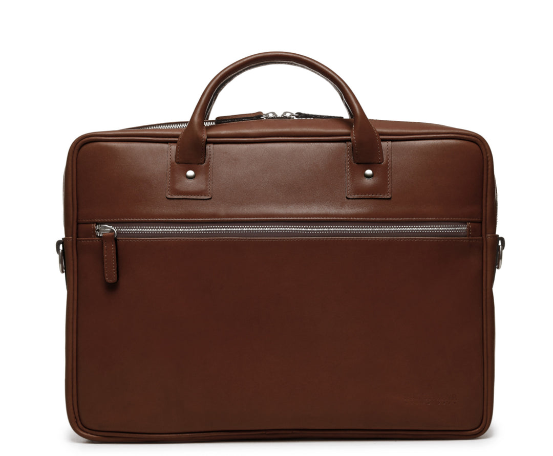 Brown Laptop Leather Briefcase  The Dylan leather briefcase features a removable, adjustable shoulder strap and built-in computer sleeve. It is designed with a secure top zipper, and can safely accommodate most 15" laptops. #color_brown