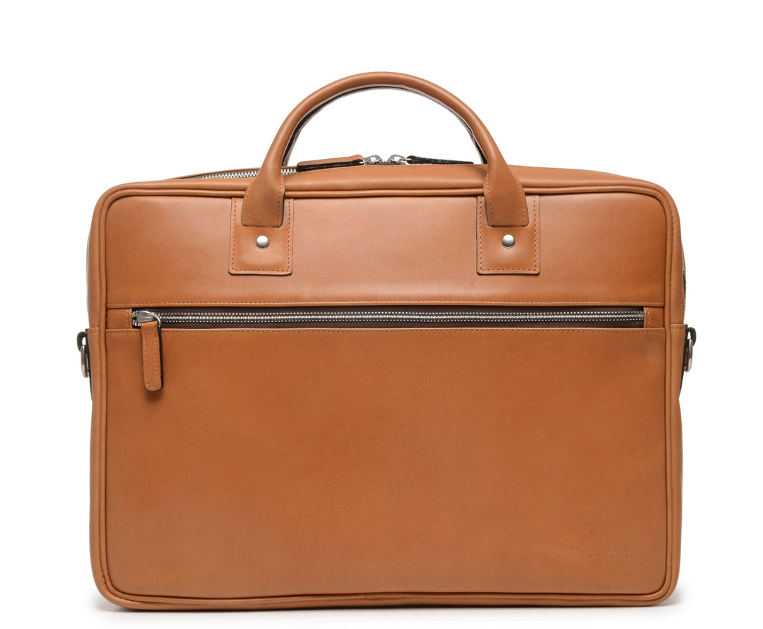 Tan Laptop Leather Briefcase  The Dylan leather briefcase features a removable, adjustable shoulder strap and built-in computer sleeve. It is designed with a secure top zipper, and can safely accommodate most 15" laptops. #color_tan