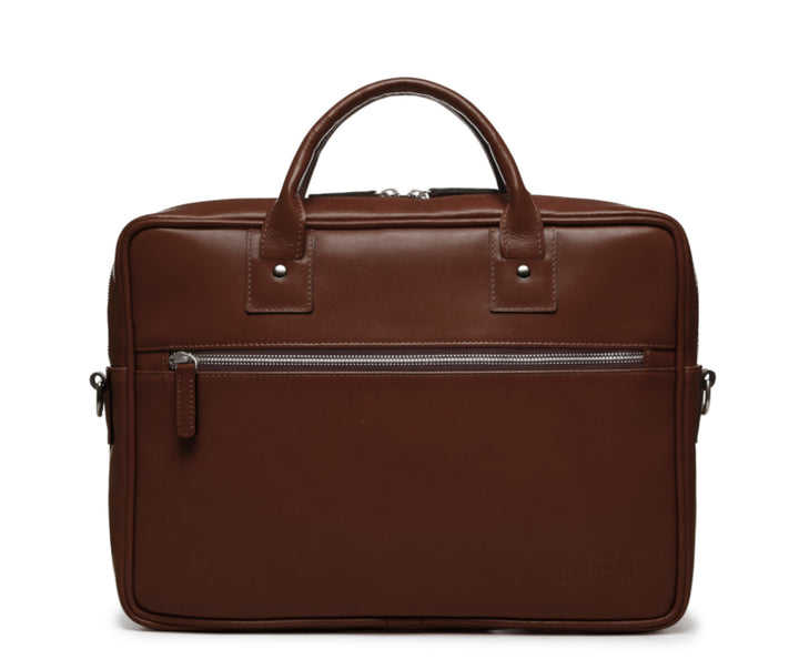 Brown Slim Leather Briefcase The Edwin leather briefcase features a removable, adjustable shoulder strap and built-in laptop sleeve. It is designed with a secure top zipper, and can safely accommodate most 13" laptops. #color_brown