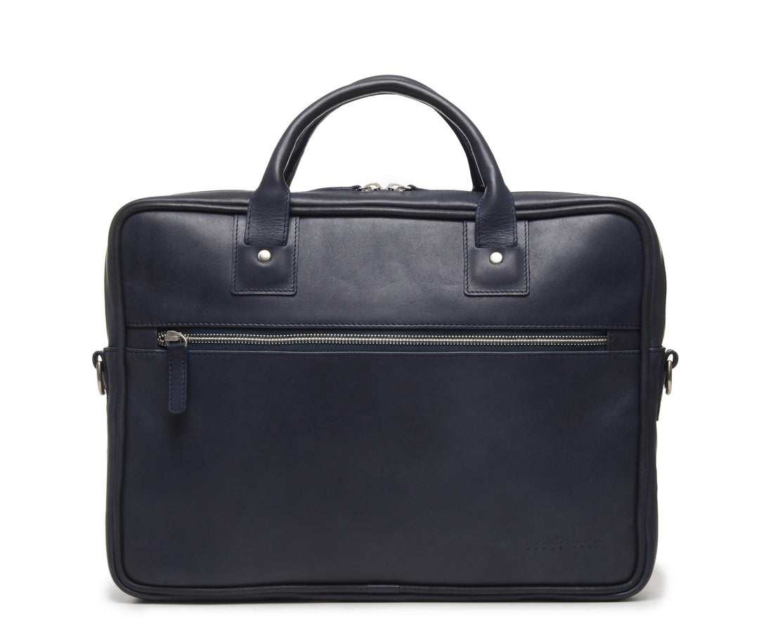 Ocean Blue Slim Leather Briefcase The Edwin leather briefcase features a removable, adjustable shoulder strap and built-in laptop sleeve. It is designed with a secure top zipper, and can safely accommodate most 13" laptops. #color_ocean-blue