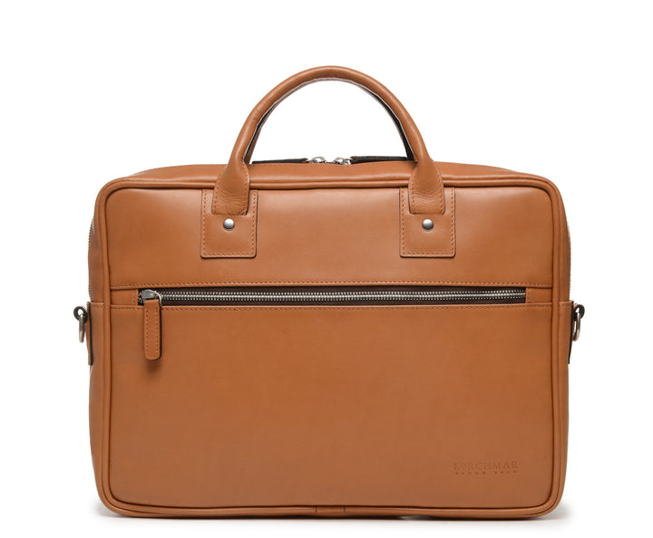 Tan Slim Leather Briefcase The Edwin leather briefcase features a removable, adjustable shoulder strap and built-in laptop sleeve. It is designed with a secure top zipper, and can safely accommodate most 13" laptops. #color_tan