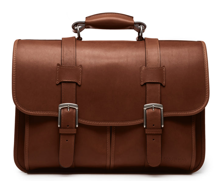 Brown Leather Laptop Briefcase The Garfield business briefcase in Korchmar's Classic Leather is made of American cowhide leather that is selected from the top 5% of available hides. Colored only with aniline dyes, this leather retains its natural beauty over time and features visible markings that are characteristic of only the finest leather.  #color_brown