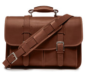 Brown Exterior back pocket and zipped interior pocket Pillow soft padded leather handle Removable, adjustable shoulder strap with ergonomic pad Carry bag strap to slide over telescoping luggage handle Protective laptop compartment Handcrafted with care in our own factory Fits up to a 15" laptop Dimensions: 16.5" x 6" x 13"