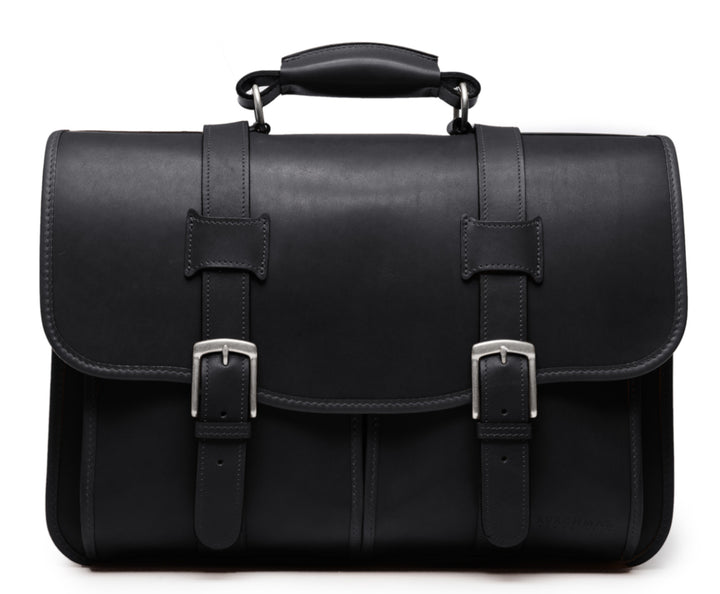 Black Leather Laptop Briefcase The Garfield business briefcase in Korchmar's Classic Leather is made of American cowhide leather that is selected from the top 5% of available hides. Colored only with aniline dyes, this leather retains its natural beauty over time and features visible markings that are characteristic of only the finest leather.  #color_black