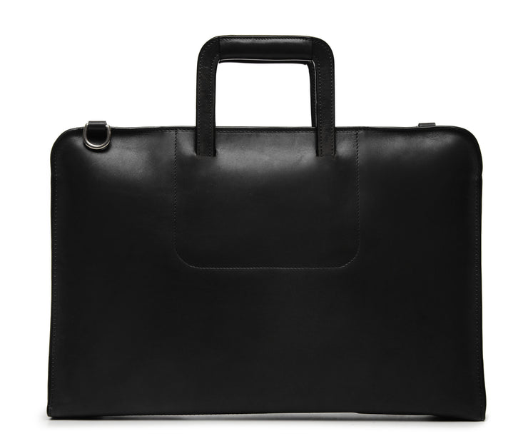 Black Leather Zippered Briefcase The Jackson is handcrafted with a beautiful full grain mill dyed American leather in a timeless Korchmar design. It includes a removable padded laptop sleeve. Historically not an item designed for shoulder carry, the new, improved design includes a full length adjustable shoulder strap.