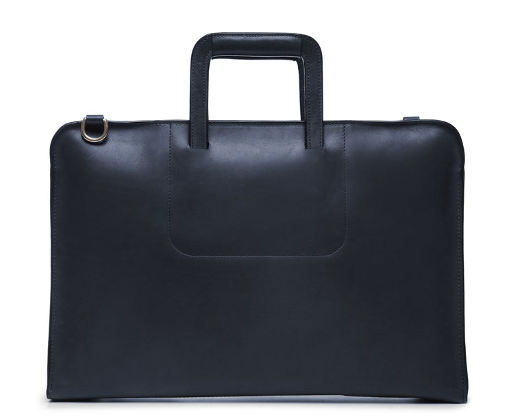 Ocean Blue Leather Zippered Briefcase The Jackson is handcrafted with a beautiful full grain mill dyed American leather in a timeless Korchmar design. It includes a removable padded laptop sleeve. Historically not an item designed for shoulder carry, the new, improved design includes a full length adjustable shoulder strap.
