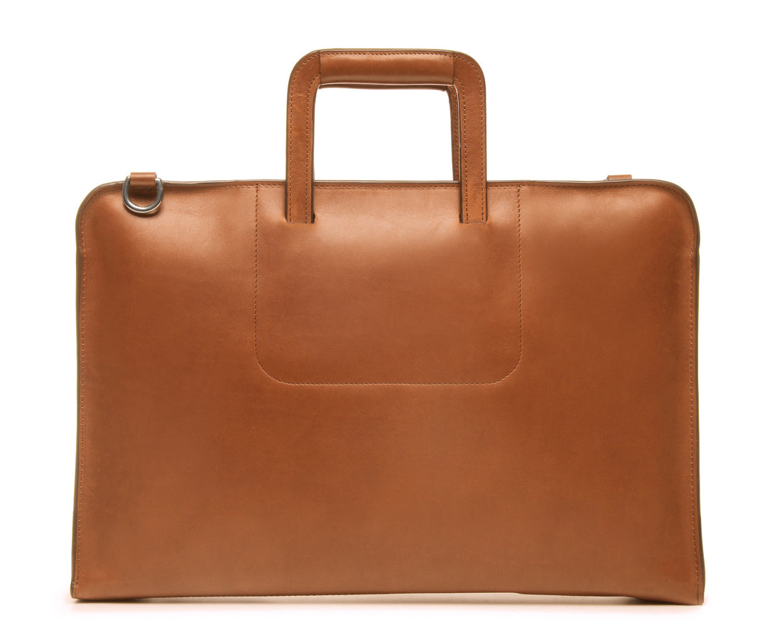 Tan Leather Zippered Briefcase The Jackson is handcrafted with a beautiful full grain mill dyed American leather in a timeless Korchmar design. It includes a removable padded laptop sleeve. Historically not an item designed for shoulder carry, the new, improved design includes a full length adjustable shoulder strap. #color_tan
