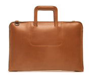 Tan Leather Zippered Briefcase The Jackson is handcrafted with a beautiful full grain mill dyed American leather in a timeless Korchmar design. It includes a removable padded laptop sleeve. Historically not an item designed for shoulder carry, the new, improved design includes a full length adjustable shoulder strap.