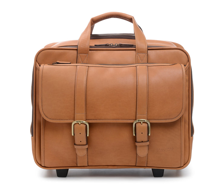 Tan Wheeled Leather Travel Briefcase The Kenton full grain leather rolling laptop bag also functions as a convenient overnight bag. It features a generous compartment for a change of clothes, as well as plenty of room for files, and padded pocket designed to safely accommodate most 15" laptops.