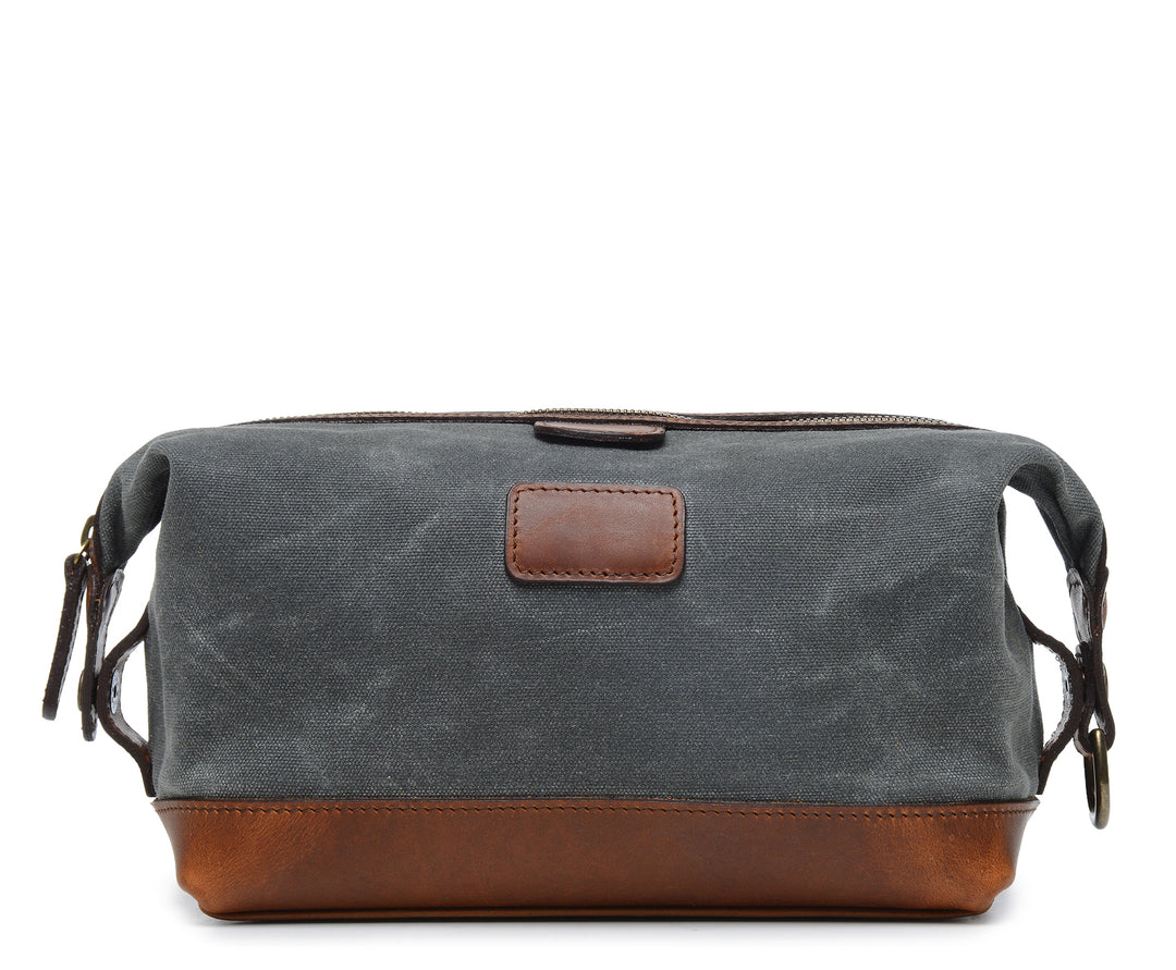 Grey Waxed Canvas Dopp Kit The Ryder is a compact waxed canvas toiletry bag with full grain leather trim. This Dopp Kit features a top zipper and snap down ends that allow for maximum expansion. #color_grey