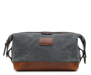 Grey Waxed Canvas Dopp Kit The Ryder is a compact waxed canvas toiletry bag with full grain leather trim. This Dopp Kit features a top zipper and snap down ends that allow for maximum expansion.