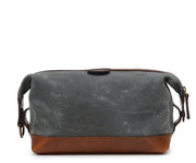 Grey Waxed canvas with full grain American leather trim Antique brass hardware Snap down ends, which allow for expansion Fully lined with signature 6.4 oz yarn dyed twill Zipper length of 13.25" Handcrafted with care in our own factory Dimensions: 11" x 5" x 6"
