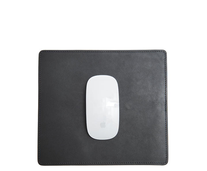 Black Full-grain American leather Backed with non-skid durable rubber mat Each mouse pad's selection is one-of-a-kind and slightly unique given the natural characteristics of the leather Handcrafted with care in our own factory Dimensions: 9" H x 8" W #color_black