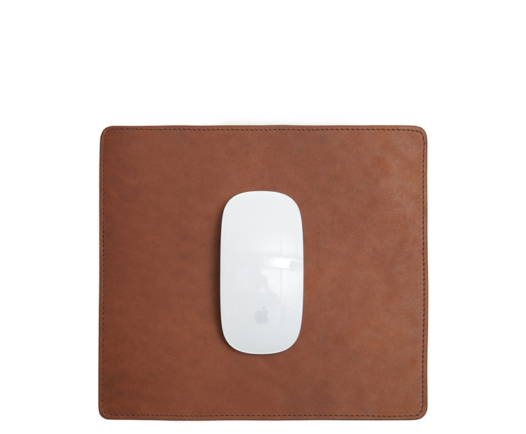 Espresso Full-grain American leather Backed with non-skid durable rubber mat Each mouse pad's selection is one-of-a-kind and slightly unique given the natural characteristics of the leather Handcrafted with care in our own factory Dimensions: 9" H x 8" W